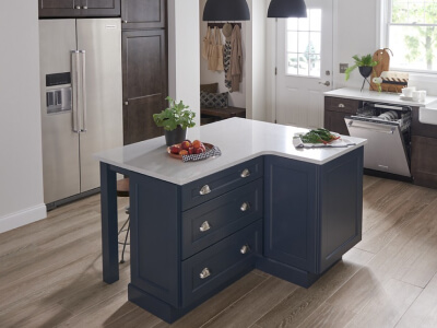 A kitchen with a large island and stainless steel appliances  A kitchen with a large island and stainless steel appliances