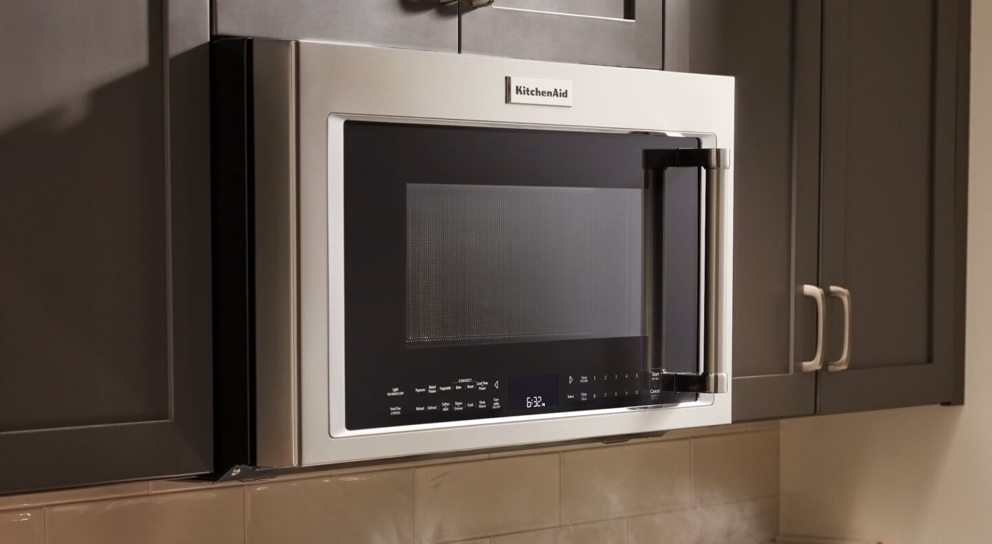 KitchenAid® over-the-range microwave in brown cabinetry KitchenAid® over-the-range microwave in brown cabinetry