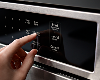 Woman starting the self-clean setting