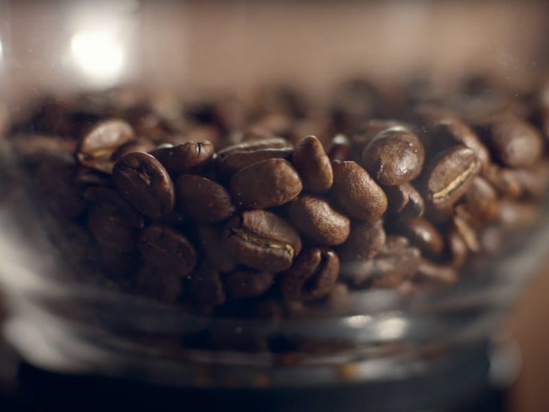 Close-up of coffee beans in glass jar