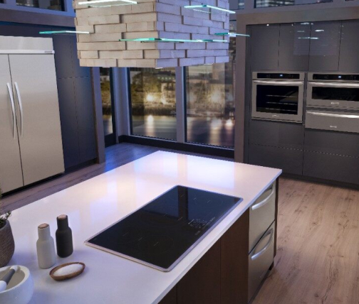 Custom range hood above an island range in a kitchen