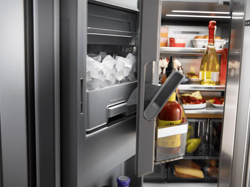 An in-door ice dispenser in a refrigerator An in-door ice dispenser in a refrigerator