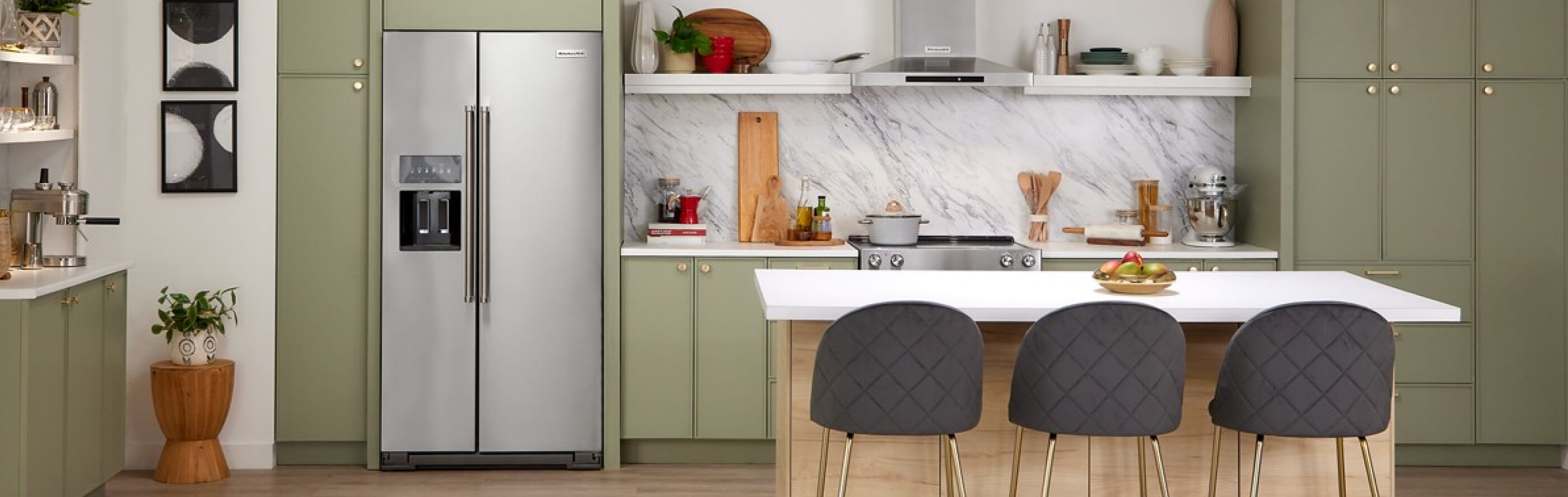 A modern kitchen with a stainless steel side-by-side refrigerator