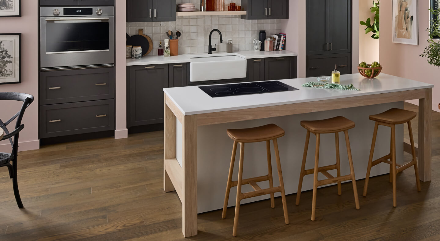 KitchenAid® induction cooktop installed in a white kitchen island