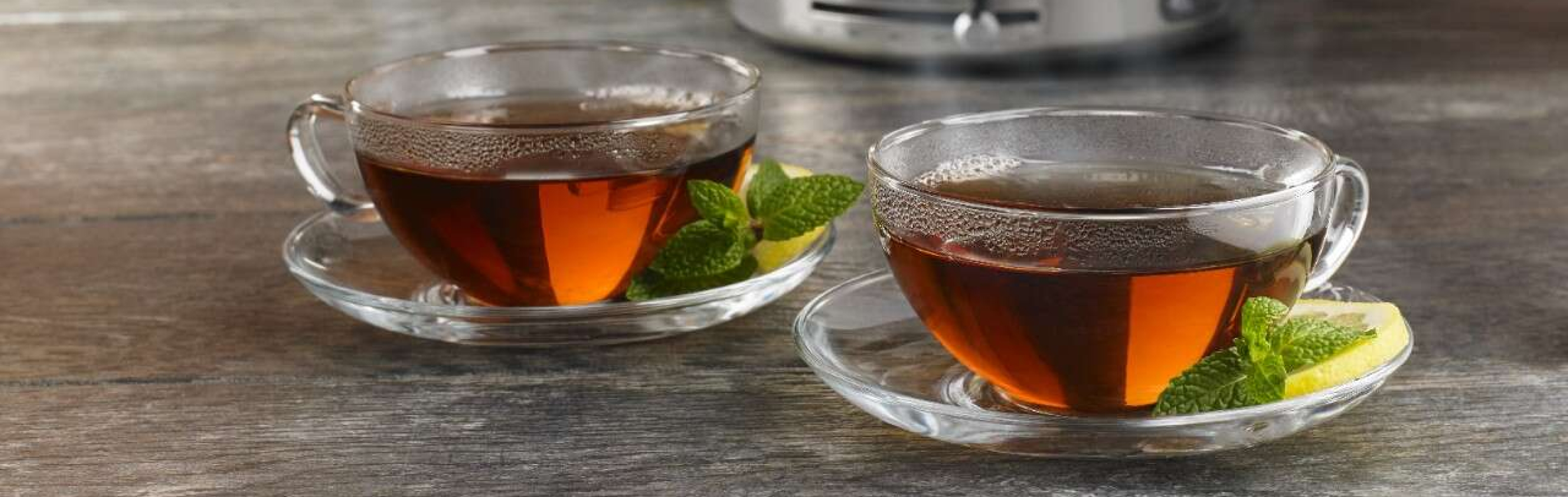 Two glass cups of tea with fresh mint
