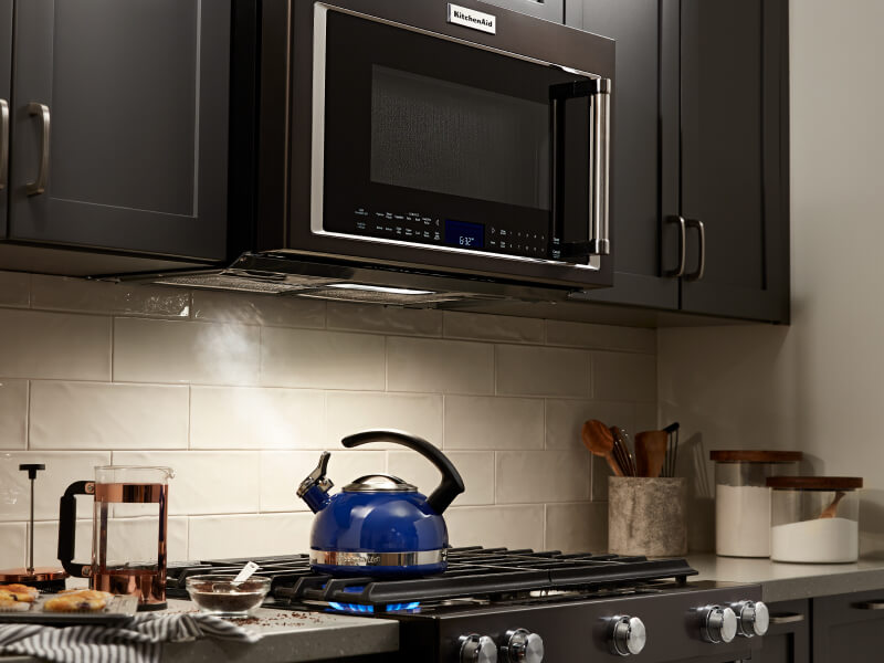 A KitchenAid® over-the-range microwave and oven in a modern kitchen