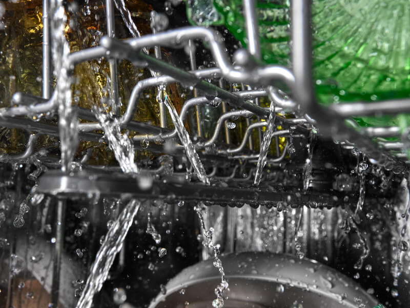 Water spraying inside of a dishwasher