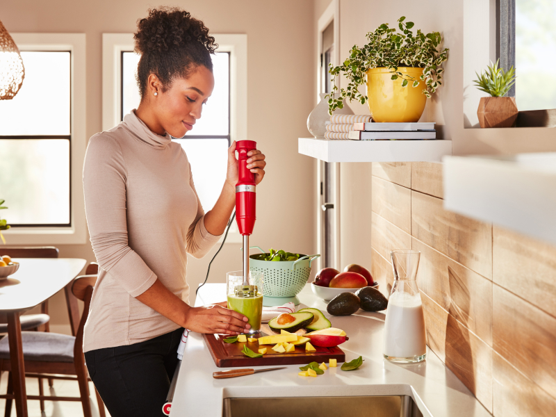 Person blending avocado smoothie withKitchenAid® hand blender 