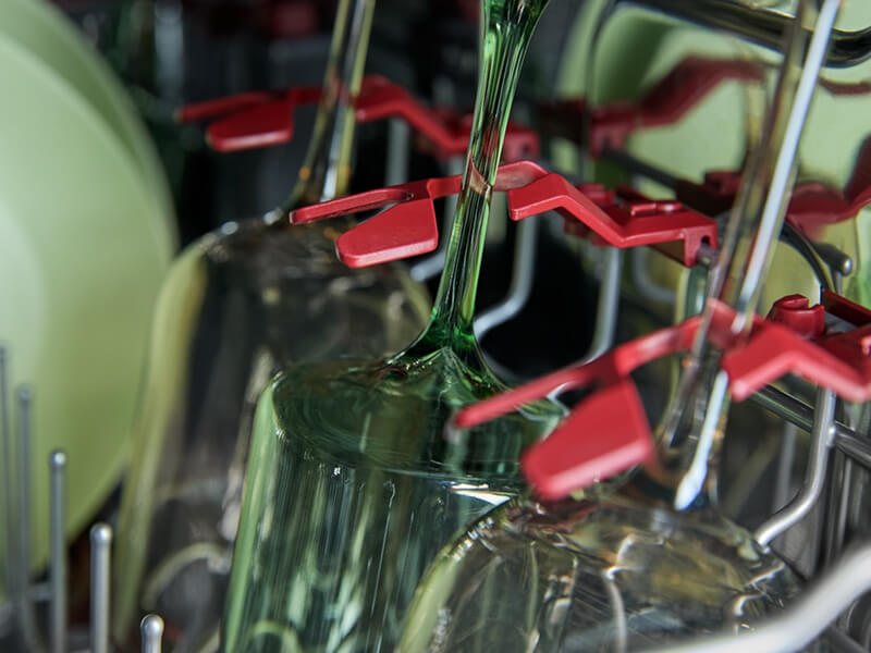 Wine glasses inside a dishwasher