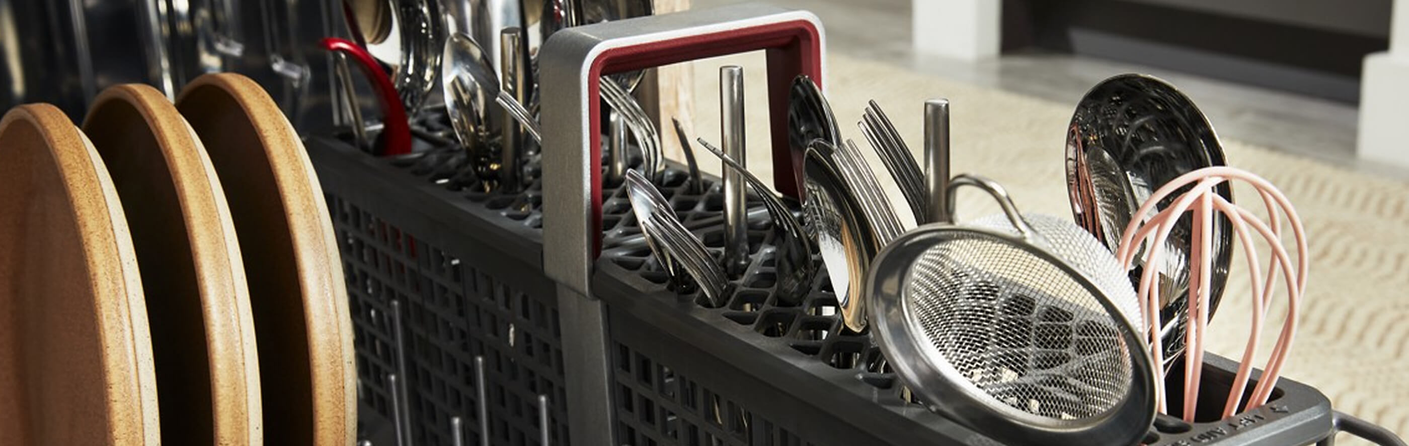 Utensils in a dishwasher utensil rack
