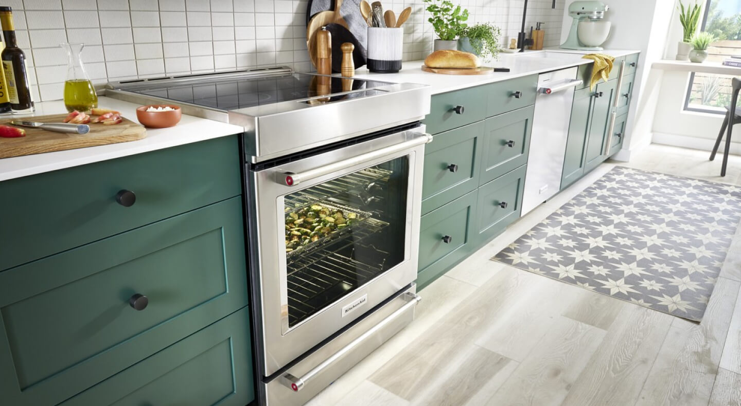 KitchenAid® oven in a kitchen with green cabinets