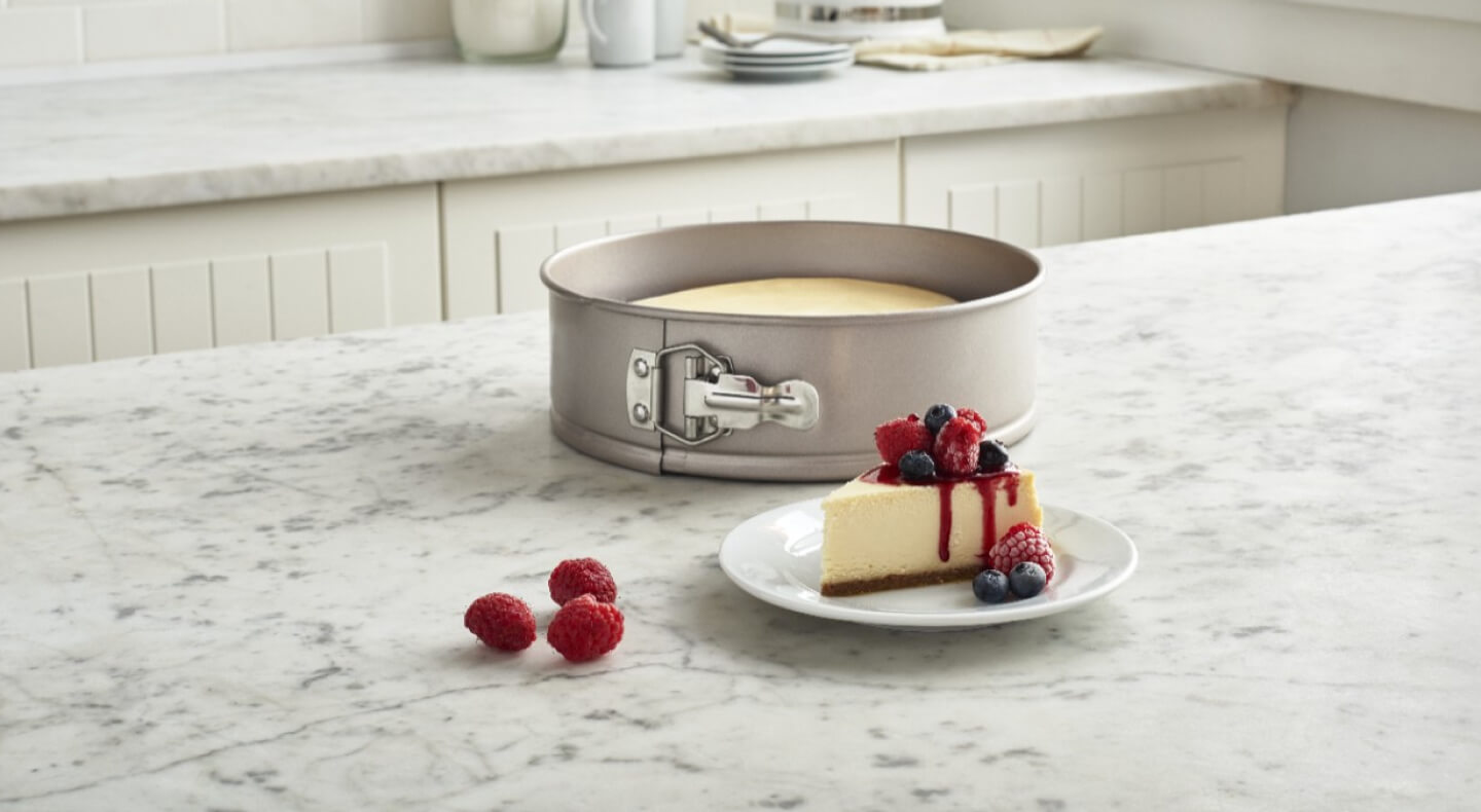 Slice of berry cheesecake on a counter