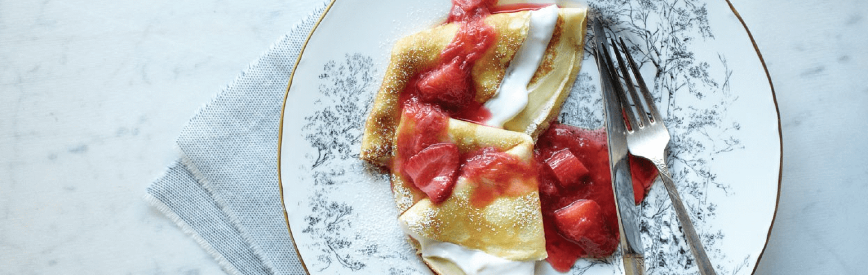 Strawberry crepes on a plate