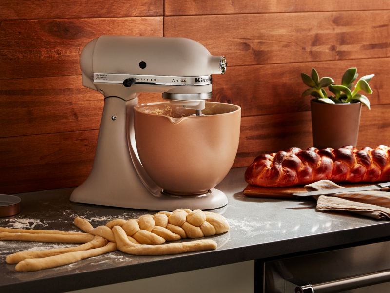 KitchenAid® stand mixer with freshly baked bread on the counter. KitchenAid® stand mixer with freshly baked bread on the counter.