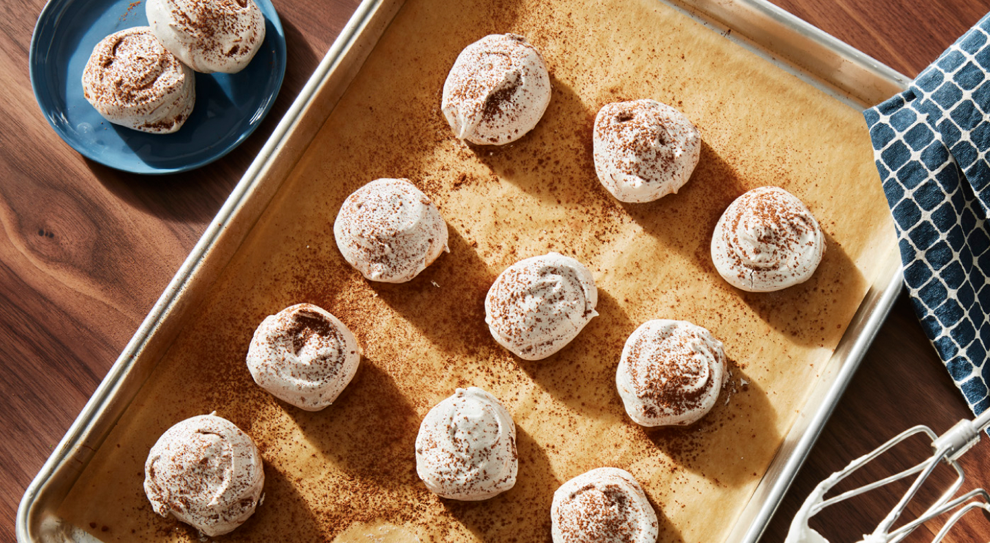 Meringue cookies topped with cocoa powder Meringue cookies topped with cocoa powder