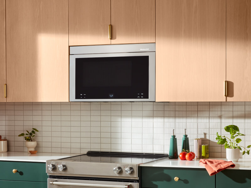 Microwave hood combination over an electric range