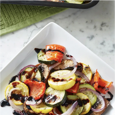 A bowl of honey mustard balsamic roasted salmon over quinoa