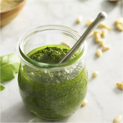 A jar of classic pesto sauce