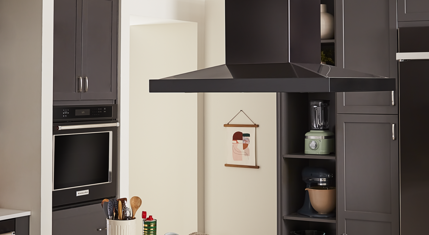 A vent hood and a single wall oven in a kitchen A vent hood and a single wall oven in a kitchen