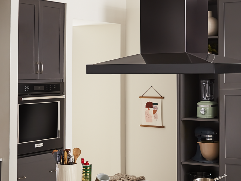 A vent hood and a single wall oven in a kitchen A vent hood and a single wall oven in a kitchen