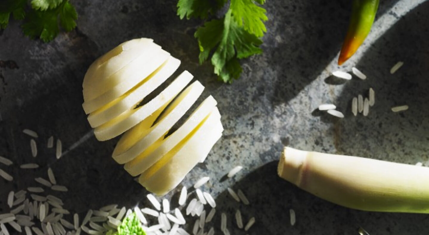 Spiral sliced potatoes on countertop with ingredients Spiral sliced potatoes on countertop with ingredients