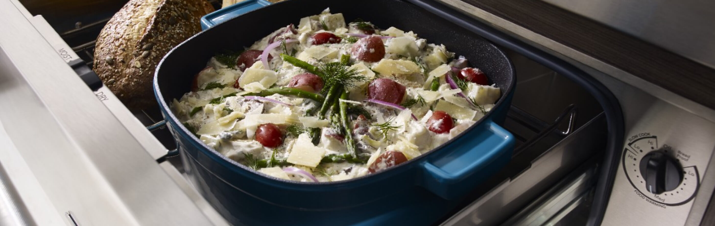 Close-up of garnished au gratin in a blue ceramic casserole dish