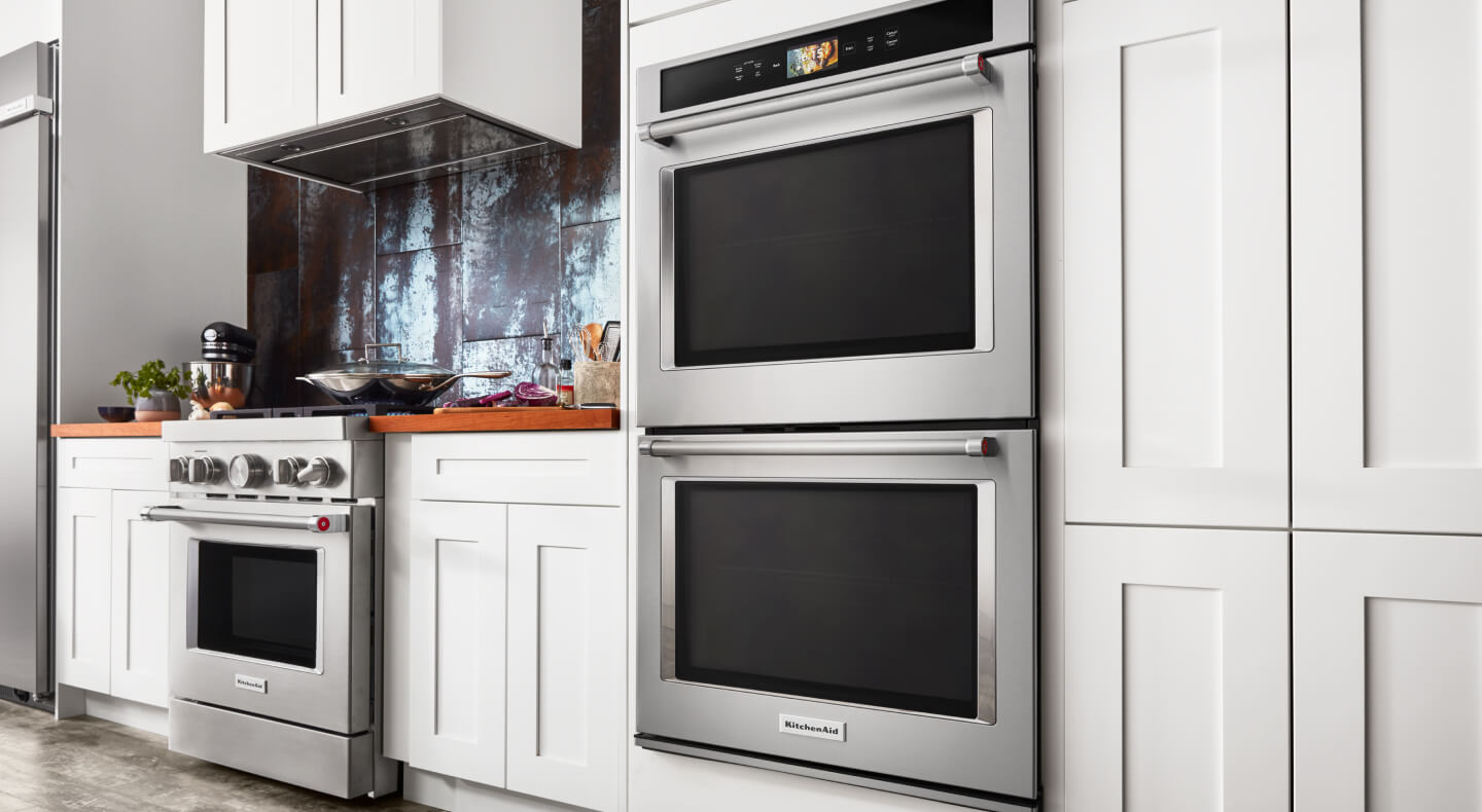 Stainless KitchenAid® double oven in white cabinetry