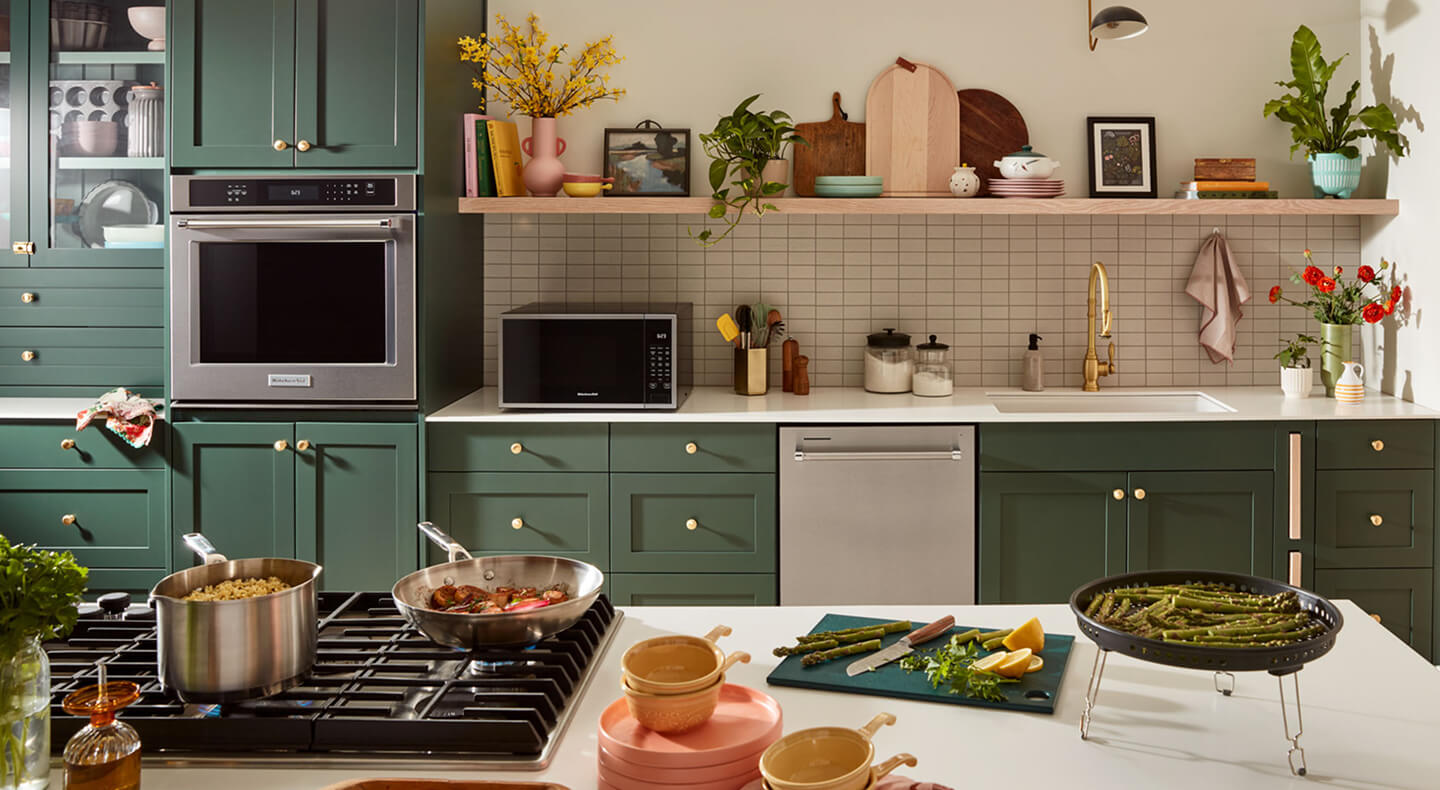 A modern kitchen with a cooktop on an island