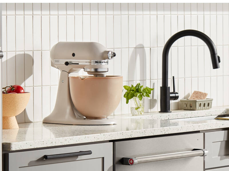 Cream KitchenAid® stand mixer with a beige mixing bowl  Cream KitchenAid® stand mixer with a beige mixing bowl