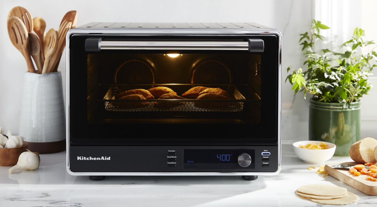 KitchenAid® countertop oven with empanadas inside KitchenAid® countertop oven with empanadas inside