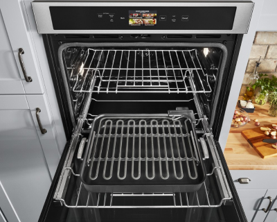 An opened KitchenAid® wall oven