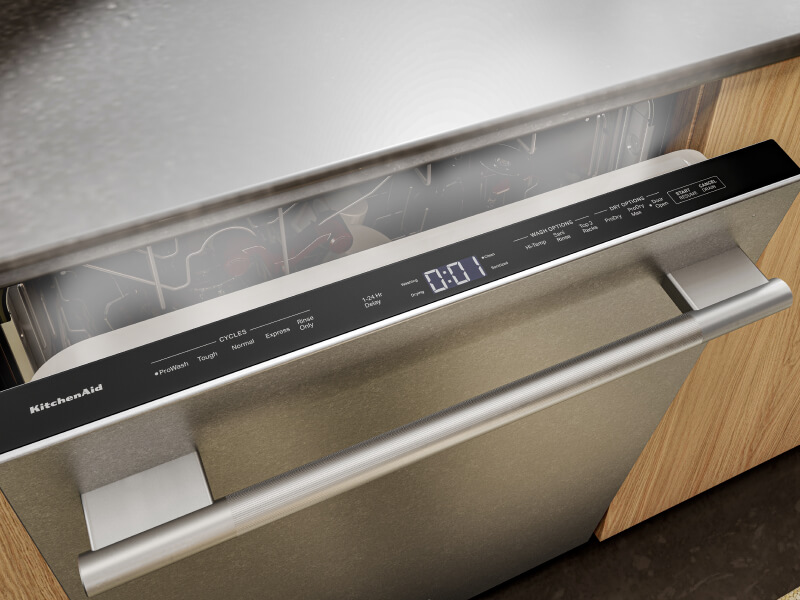 Close-up of top control dishwasher cracked open and releasing steam