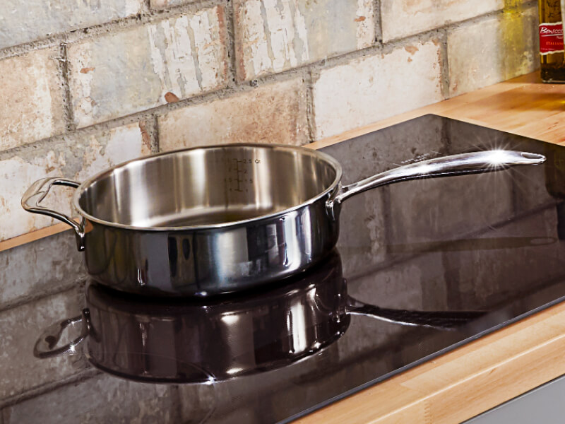 A saute pan on a cooktop