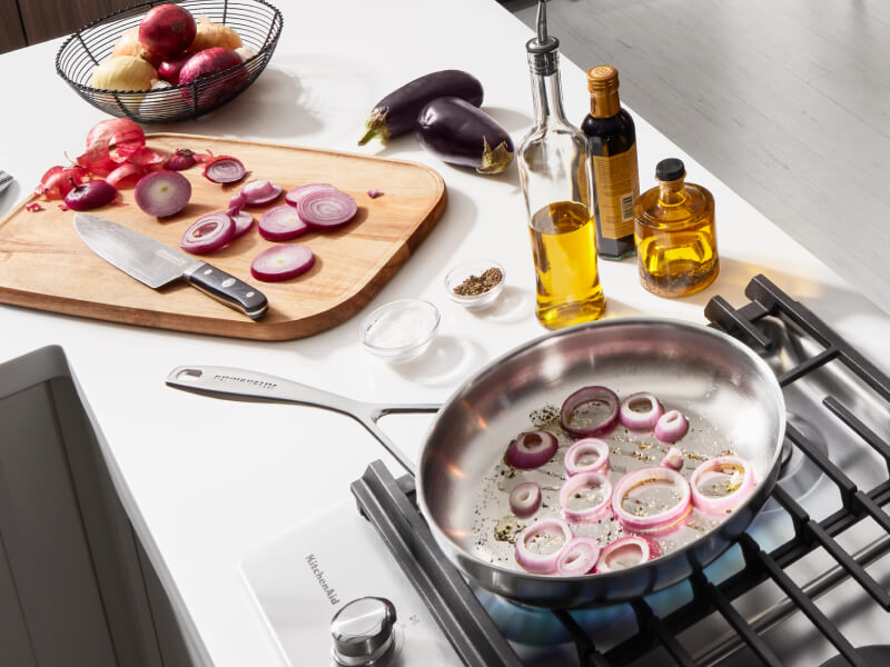 Onions in a pan on the stovetop Onions in a pan on the stovetop