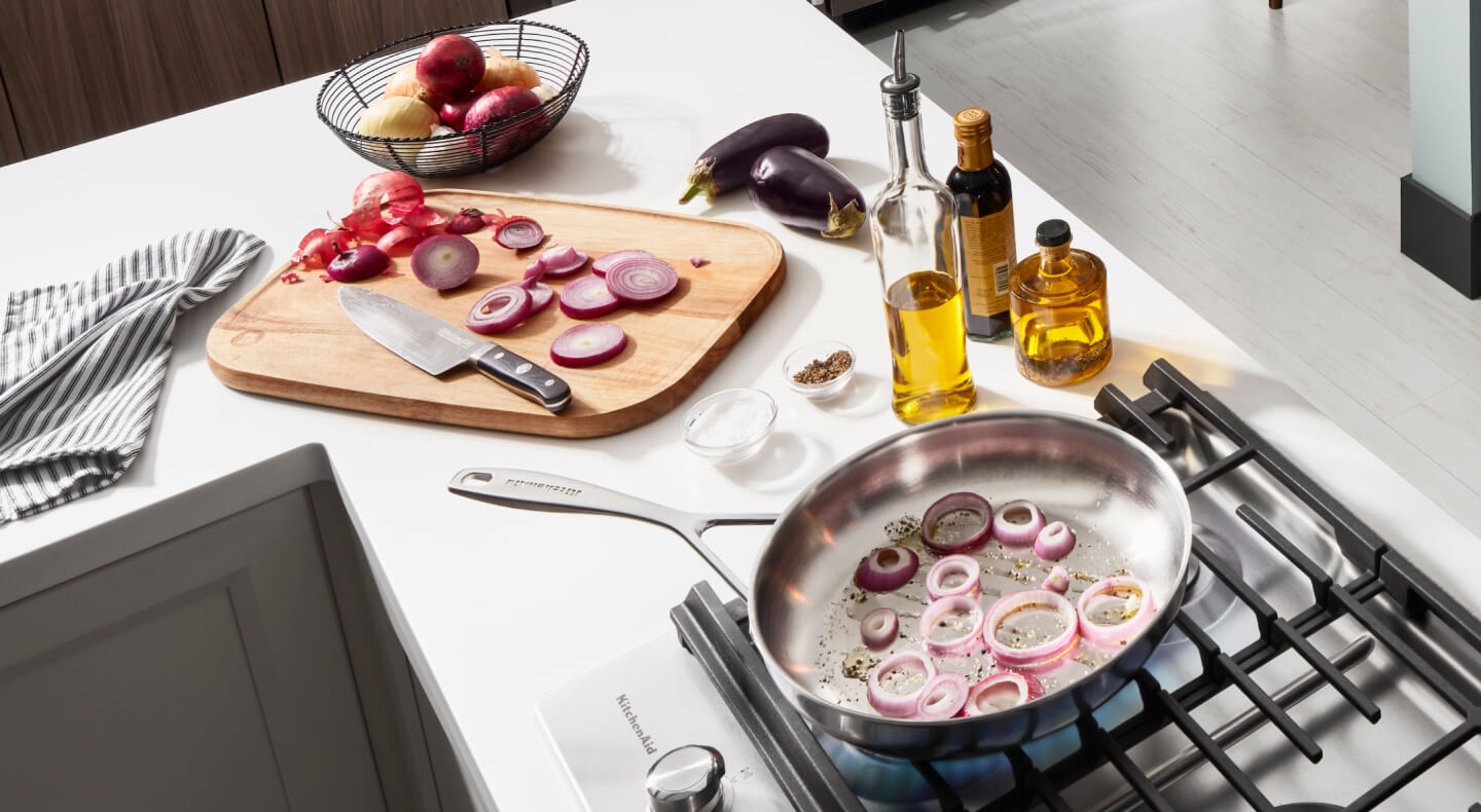 Onions in a pan on the stovetop Onions in a pan on the stovetop