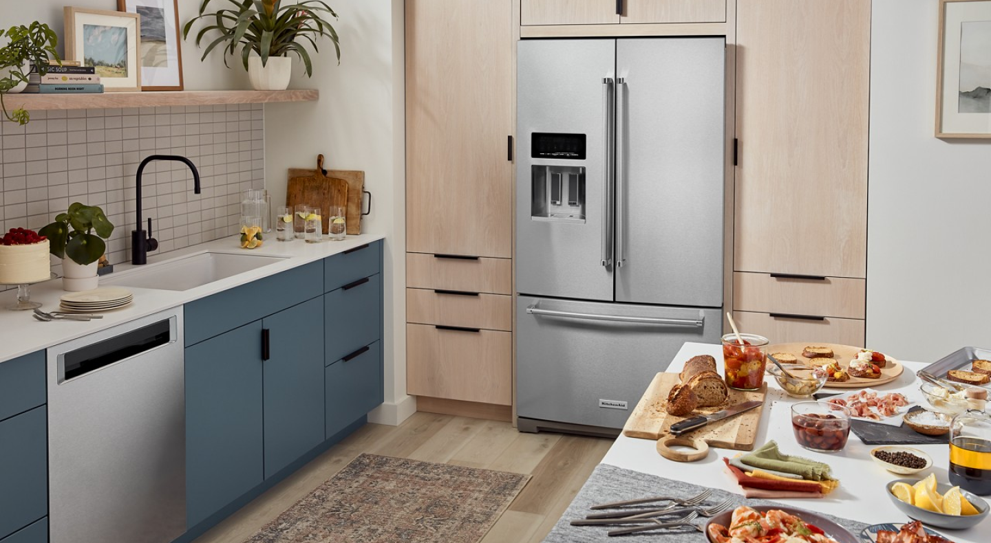 KitchenAid® French-door refrigerator in light brown cabinetry 