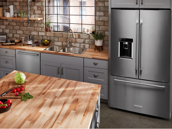 Stainless steel, KitchenAid® French-door refrigerator in gray cabinetry