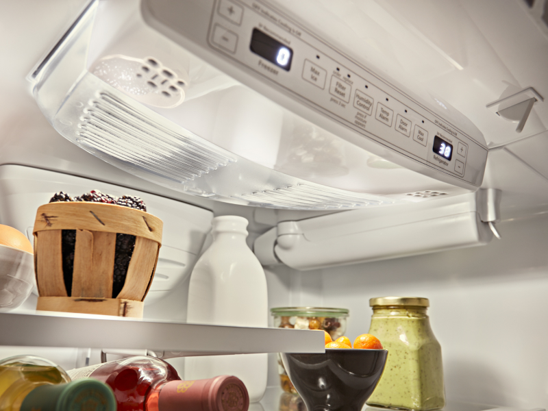 Close-up of a refrigerator control panel above food in the refrigerator Close-up of a refrigerator control panel above food in the refrigerator