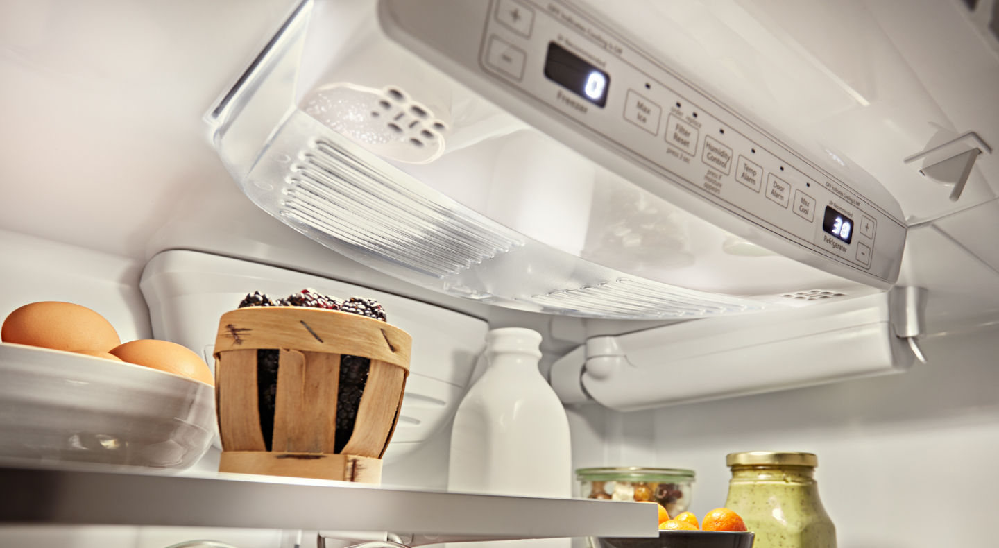 Close-up of a refrigerator control panel above food in the refrigerator Close-up of a refrigerator control panel above food in the refrigerator