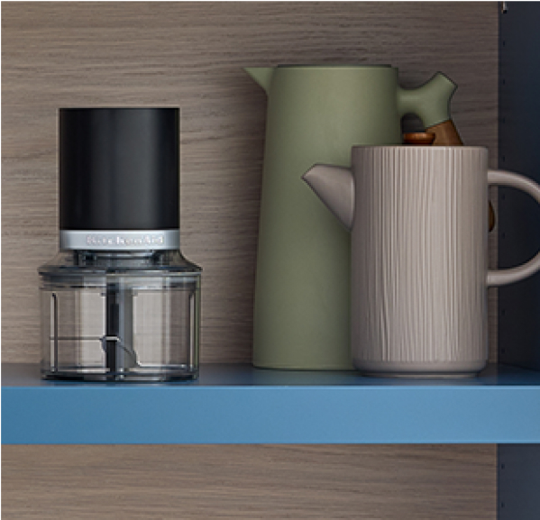 A KitchenAid Go™ Cordless Top Down Chopper on a shelf