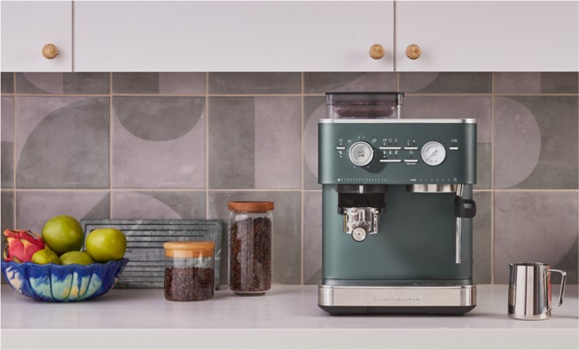 A KitchenAid Espresso Machine against a tiled backsplash