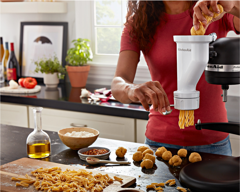 A KitchenAid Stand Mixer with a pasta roller attachment
