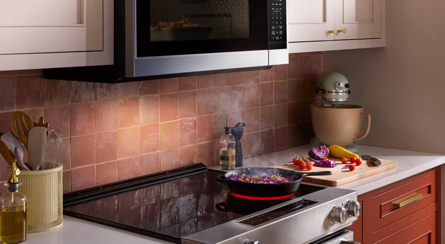 A cast-iron skillet on a KitchenAid® induction range