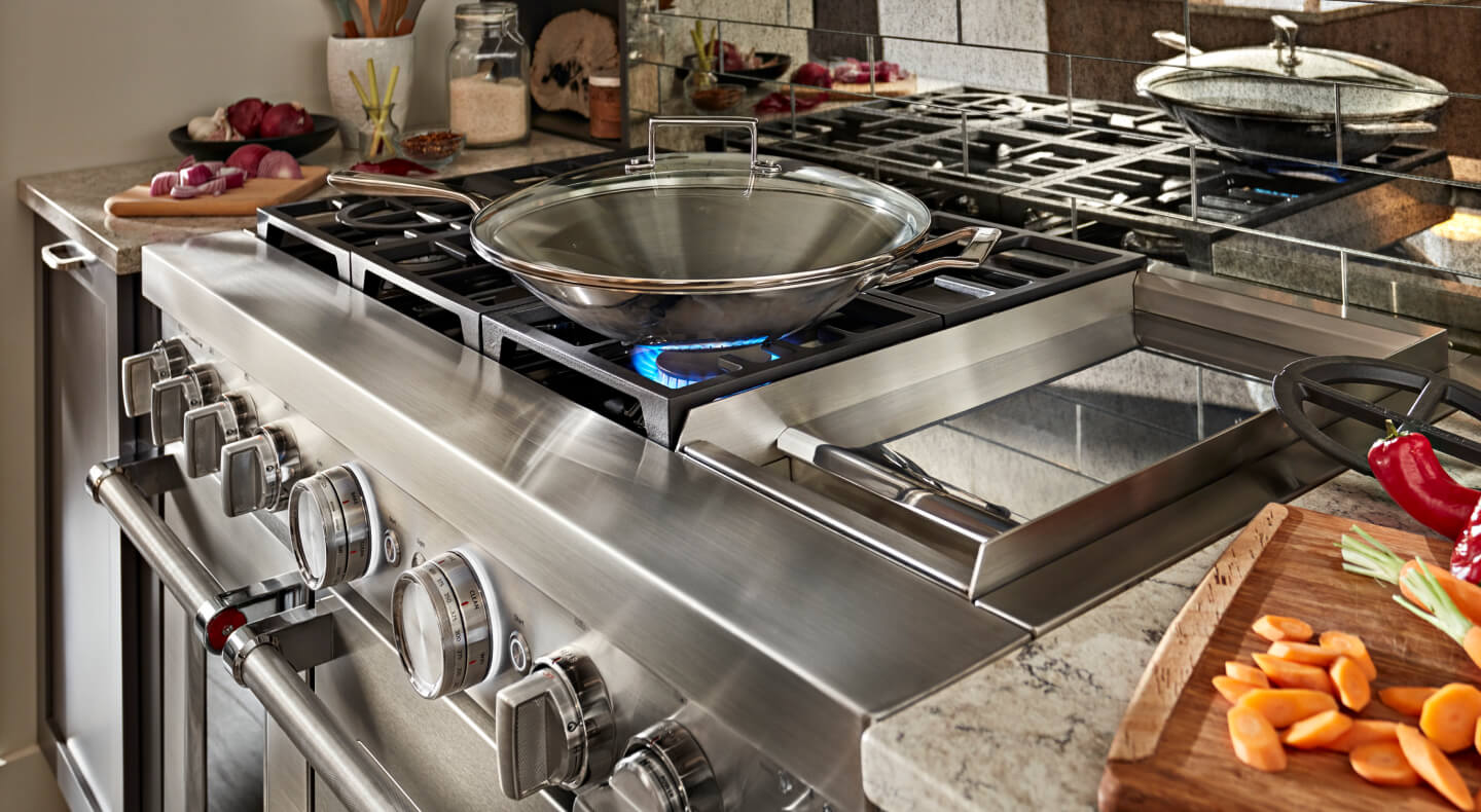 Wok on a gas range cooktop Wok on a gas range cooktop