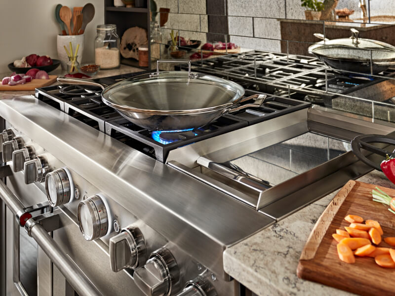 Wok on a gas range cooktop Wok on a gas range cooktop