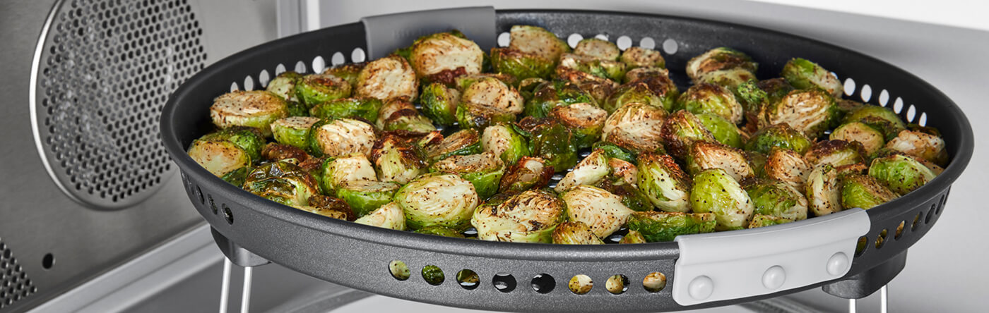 Brussels sprouts in an air fryer basket