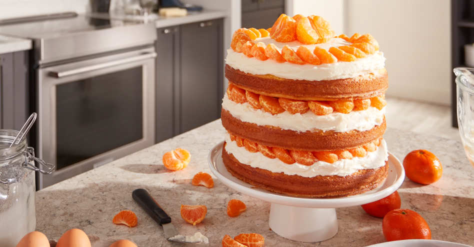 Three layer citrus cake on a cake stand Three layer citrus cake on a cake stand