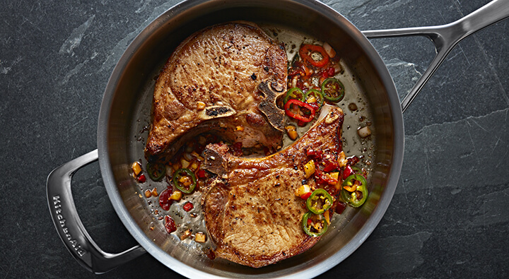 Steak cooking in a marinade inside a KitchenAid® stainless steel pan Steak cooking in a marinade inside a KitchenAid® stainless steel pan