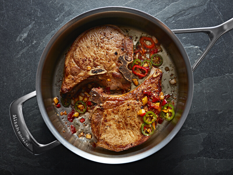 Steak cooking in a marinade inside a KitchenAid® stainless steel pan Steak cooking in a marinade inside a KitchenAid® stainless steel pan