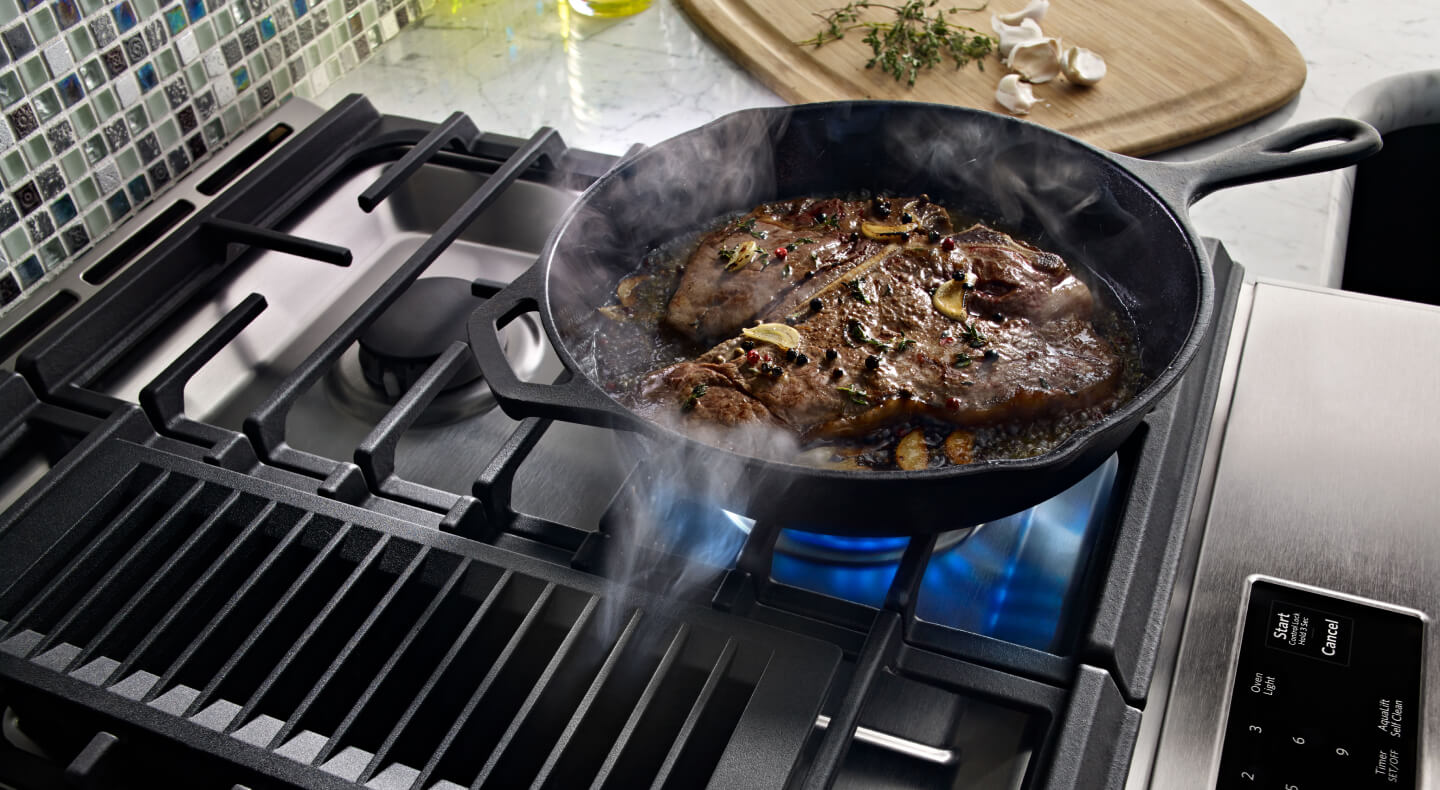Porterhouse steak with mushrooms in a cast iron pan
